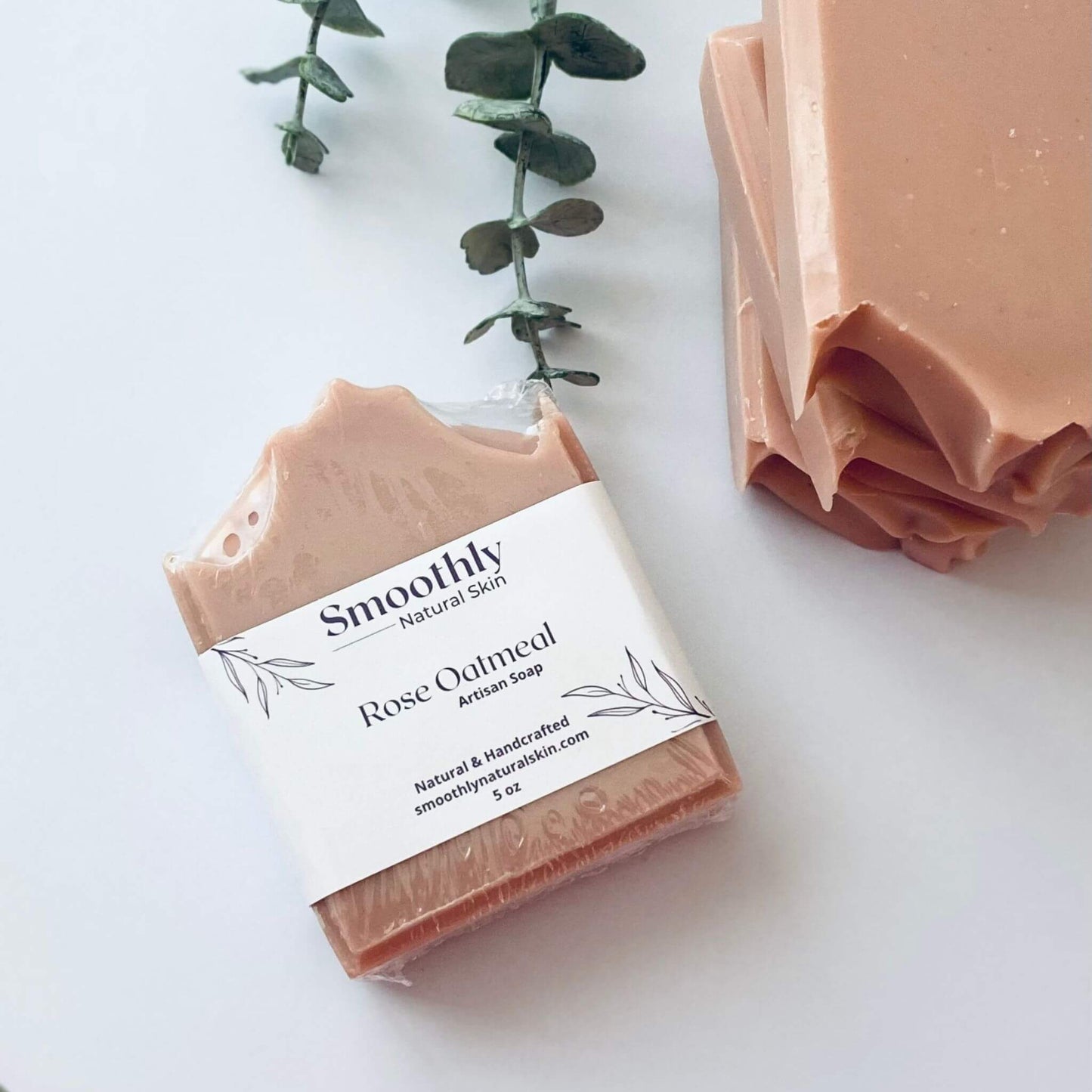 Natural handcrafted rose oatmeal soap, designed to exfoliate and hydrate the skin with the calming properties of rose and the soothing texture of oatmeal.